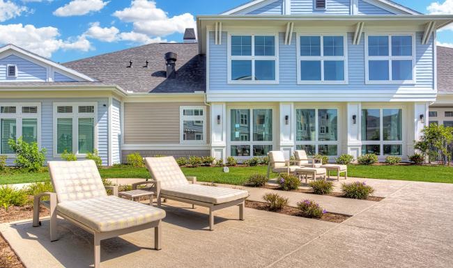 a row of chairs outside a house