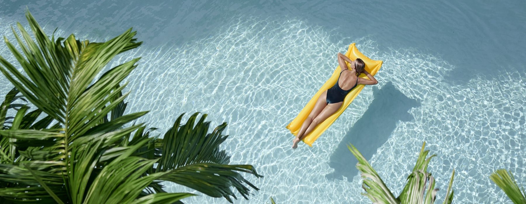 a person on a yellow floaty in the water